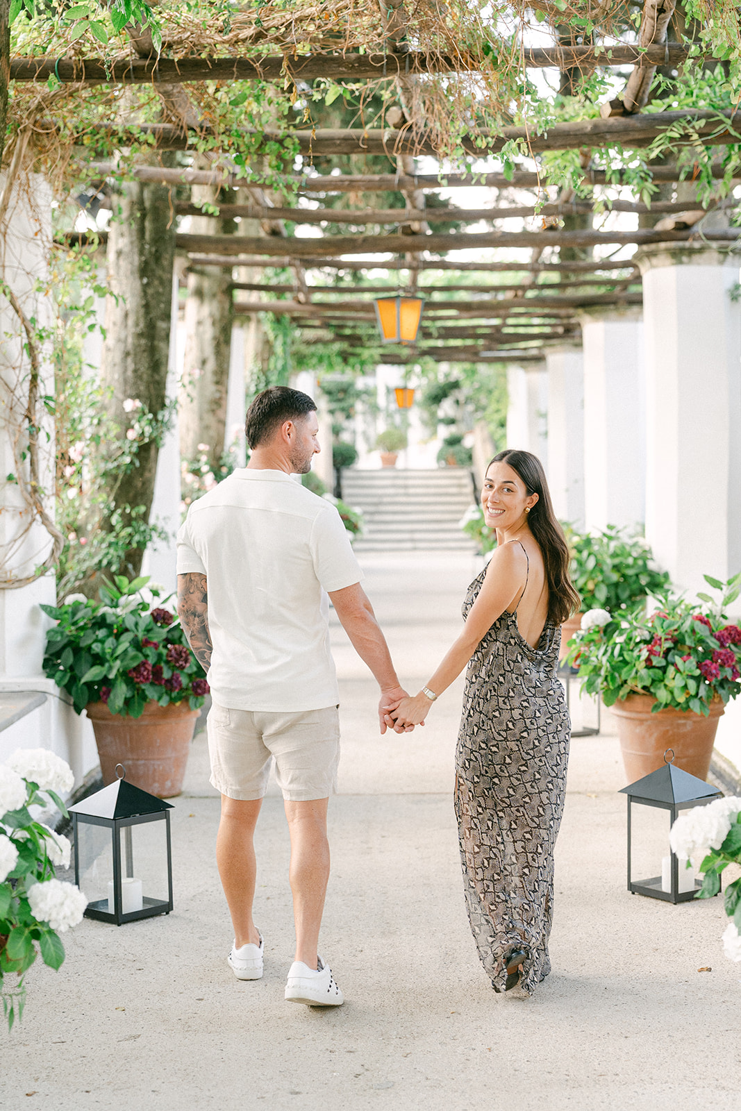 Andrea Gallucci - Destination Wedding Photographer- Amalfi Coast Positano Santorini Barcellona Rome Ravello Paris New York Newly engaged couple walking through Amalfi Coast village