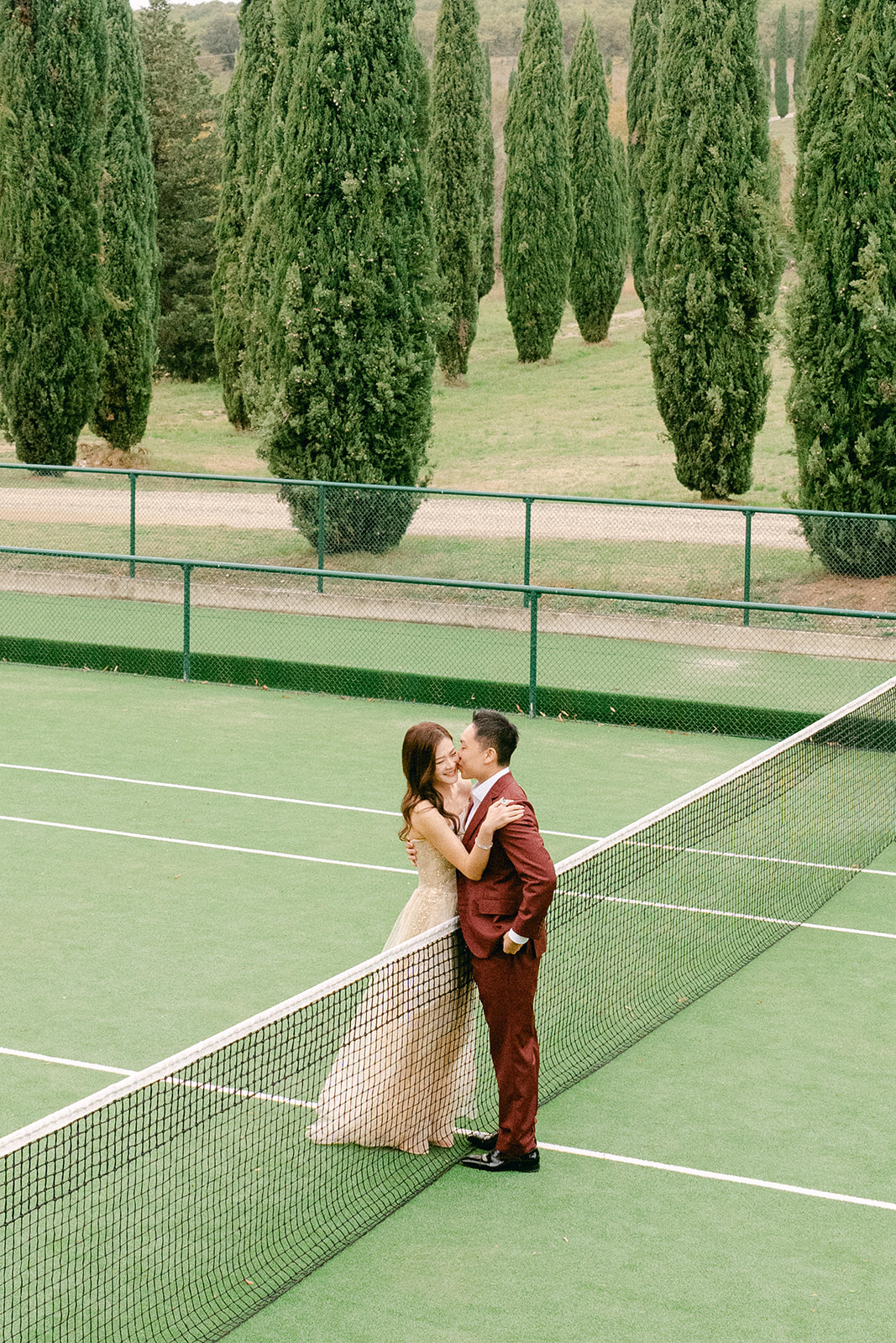 Editorial bridal portrait at Italian villa wedding in Tuscany at a tennis court