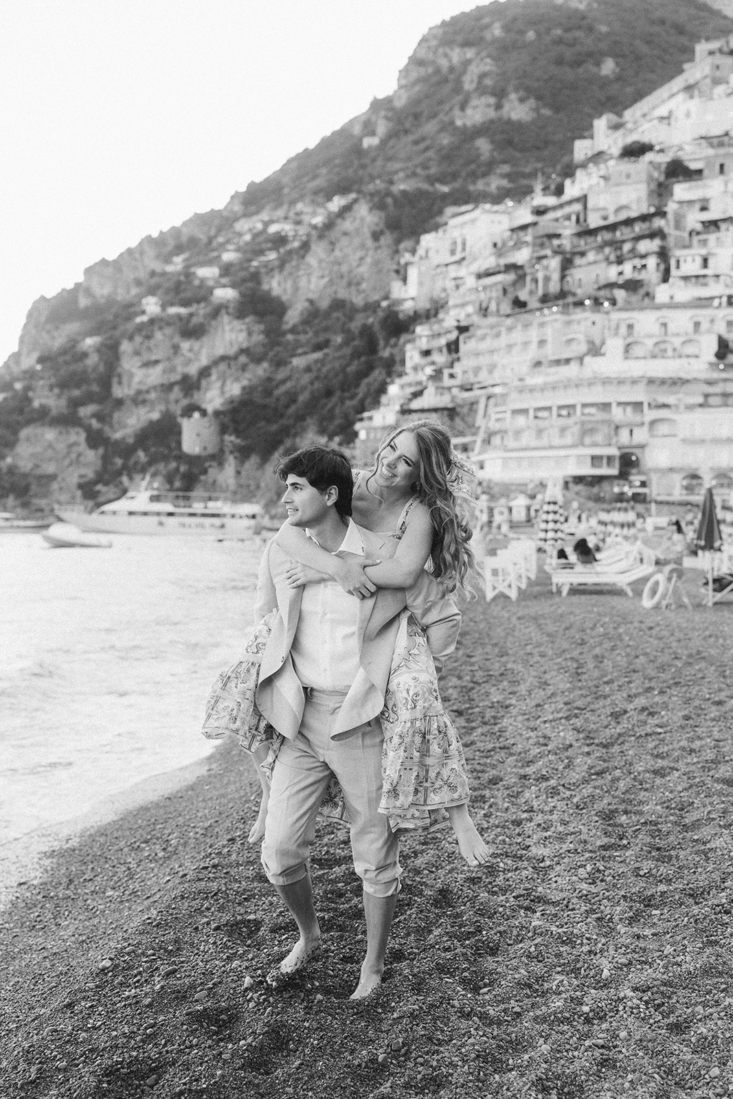 Couple exploring Positano beach during an Amalfi Coast vacation photoshoot