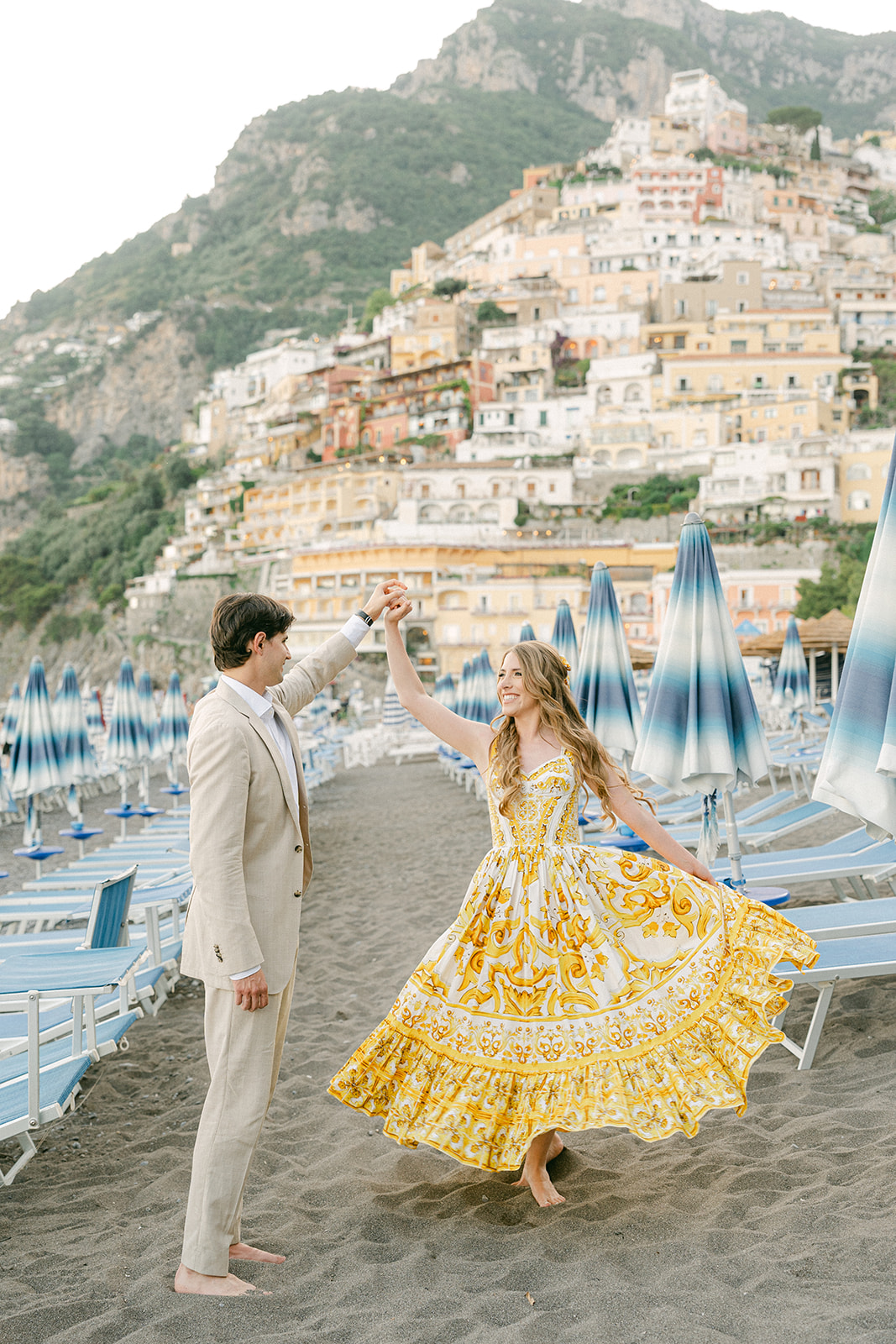 Romantic engagement photoshoot on Positano beach during an Amalfi Coast vacation