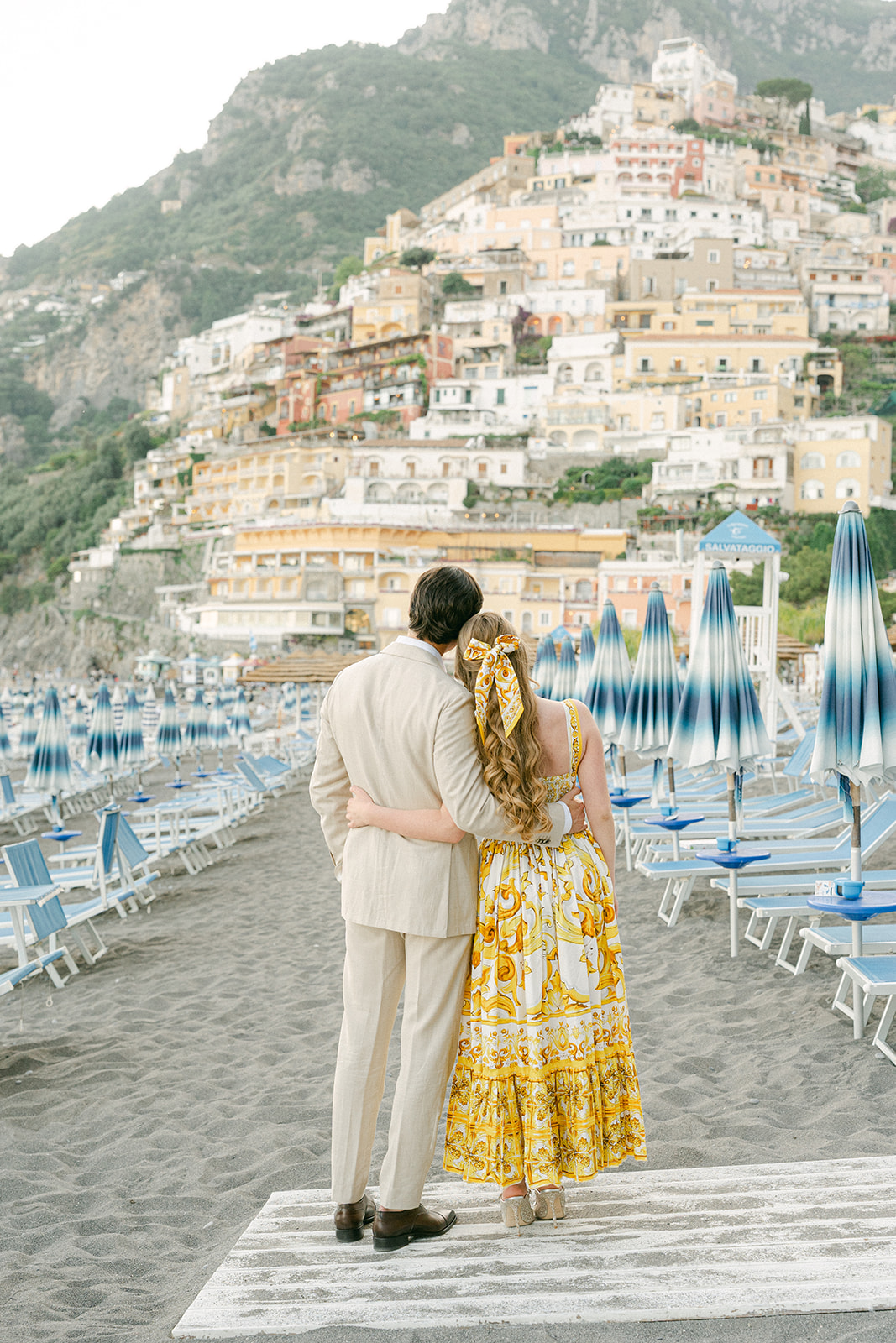 Positano beach engagement photoshoot with colorful Amalfi Coast village backdrop