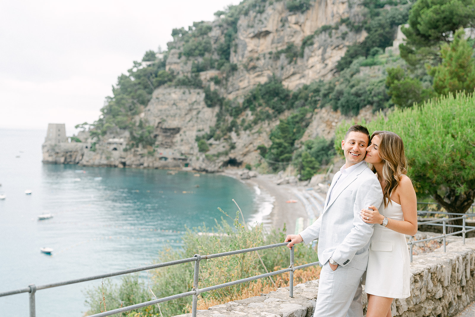 Couple enjoying views over the Amalfi Coast during engagement photos