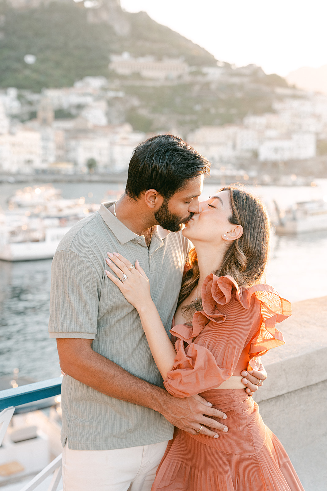 Couple embracing with sea views during an Amalfi Coast vacation photoshoot