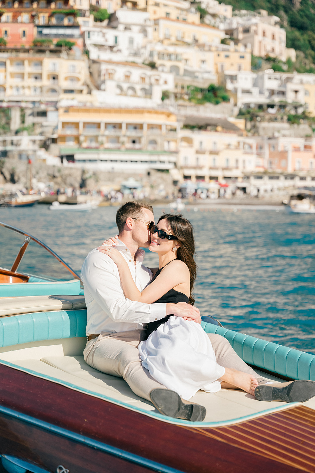 Amalfi Coast vacation engagement photos on a classic Italian boat ride