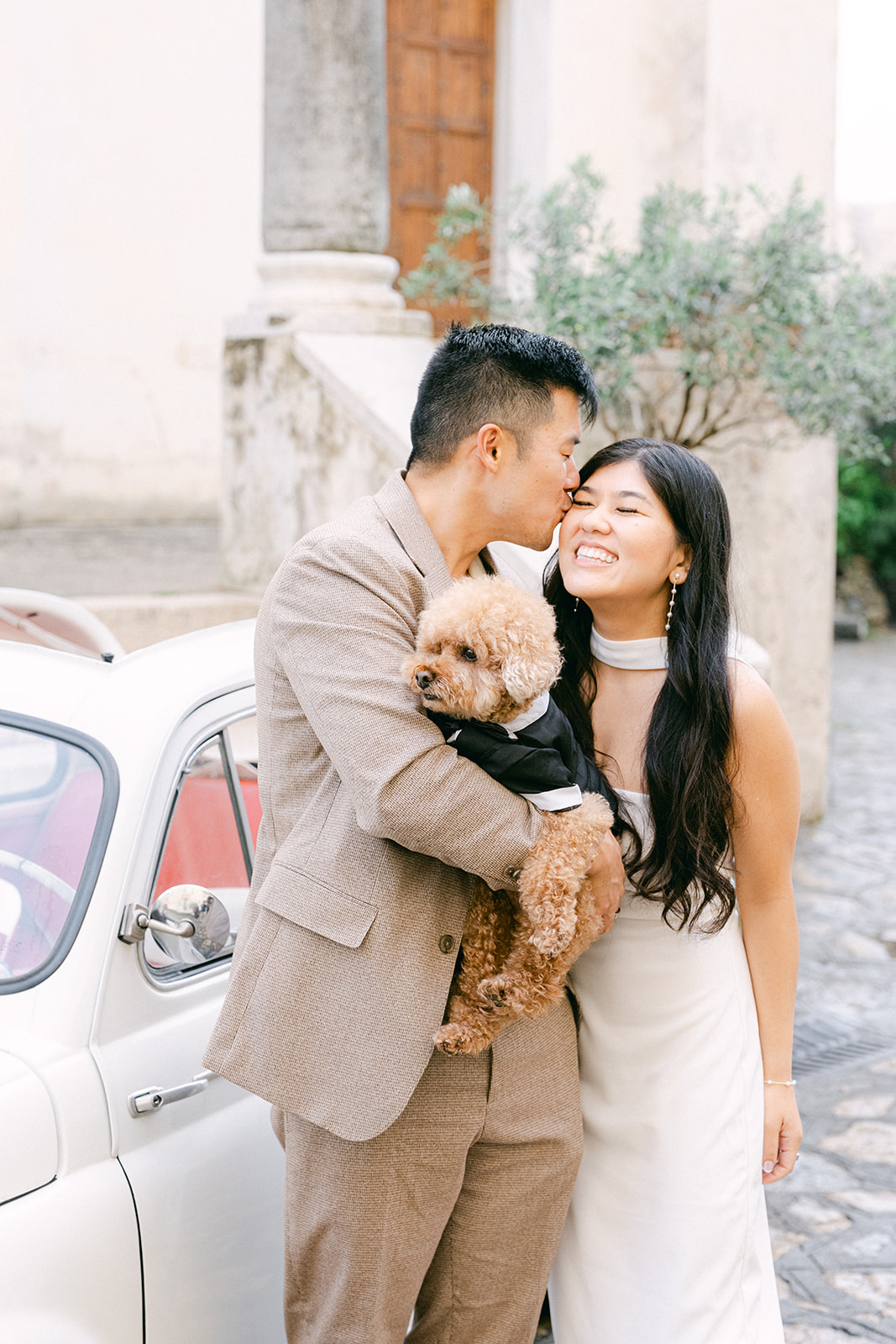 Candid engagement photos with dog in Ravello streets