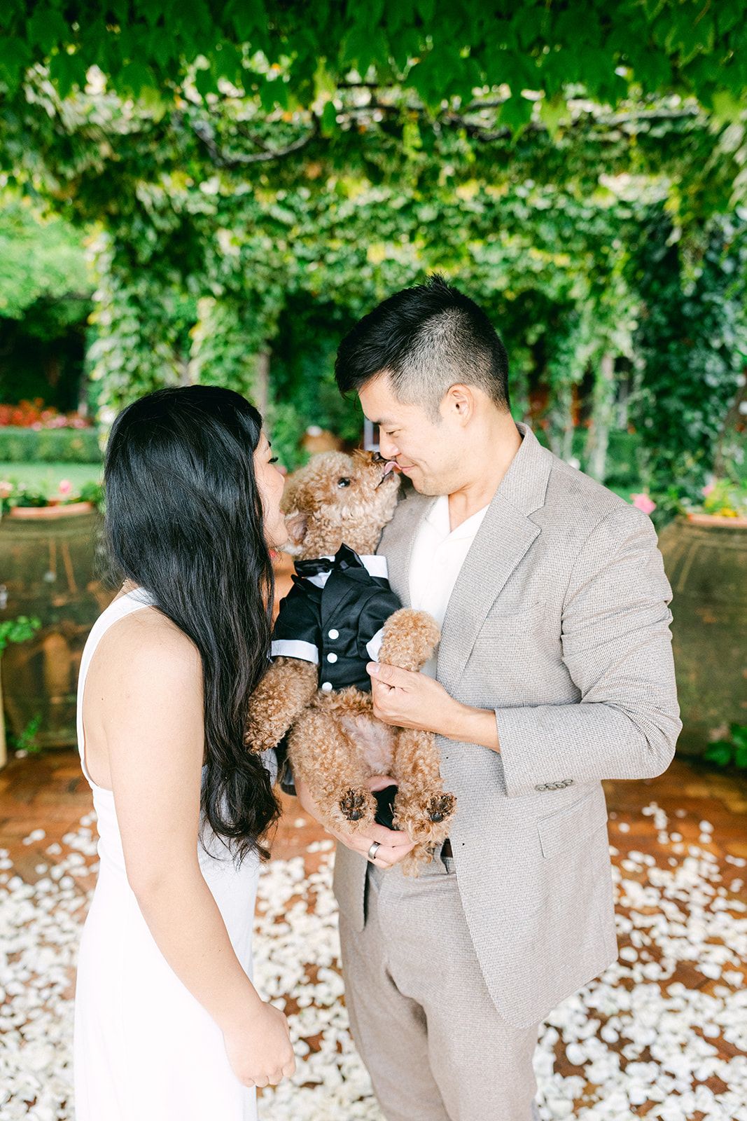 Couple playing with dog during engagement photoshoot Amalfi Coast
