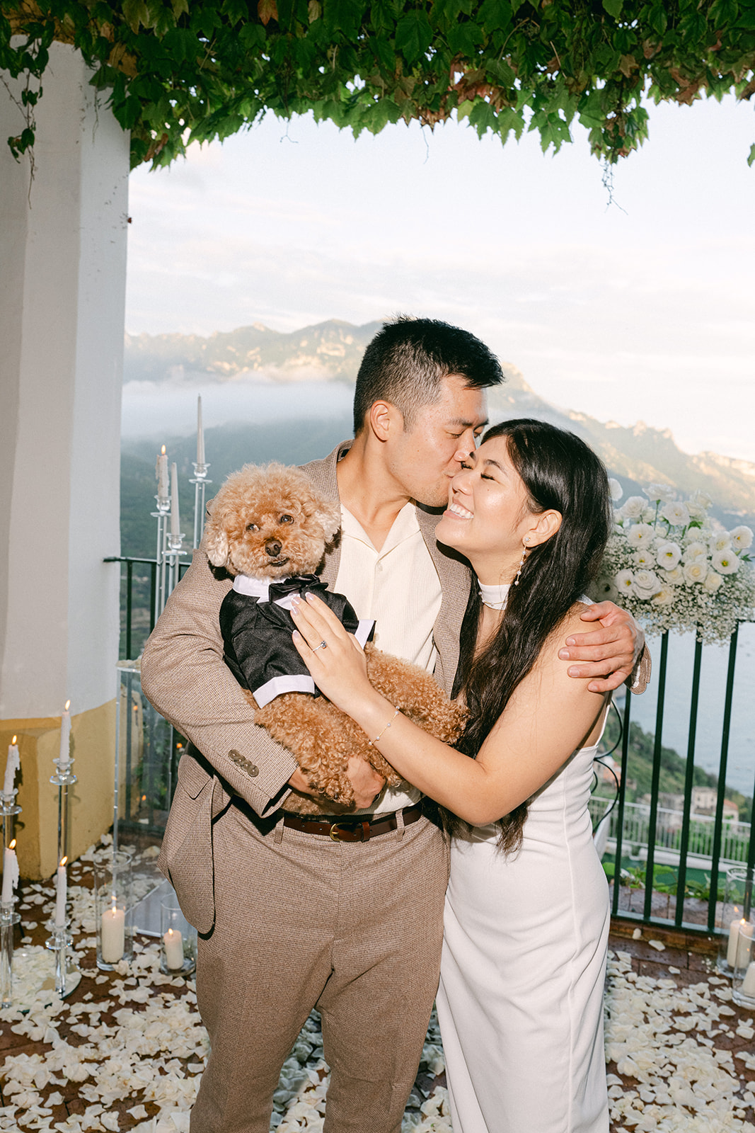 Couple hugging their dog after proposal in Ravello