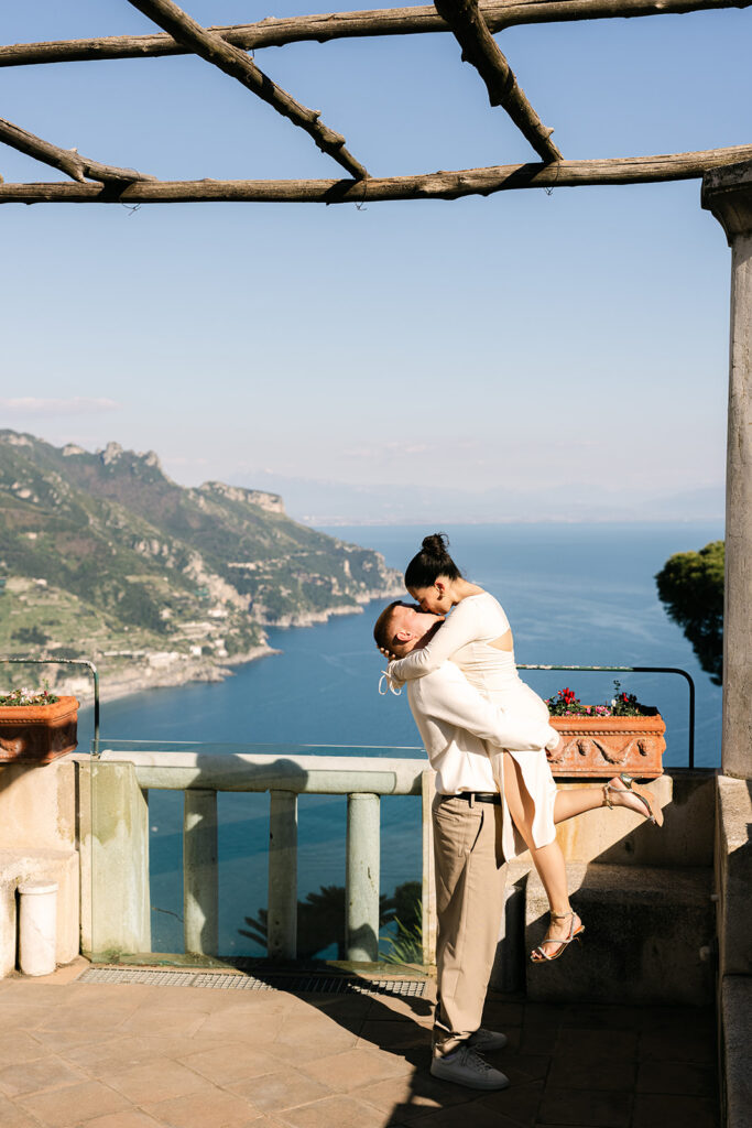 Surprise proposal idea in Positano with candid engagement photos