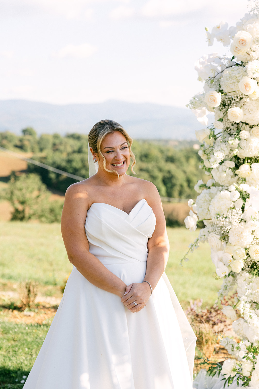 Bride and groom exchanging vows during a Tuscany wedding ceremony