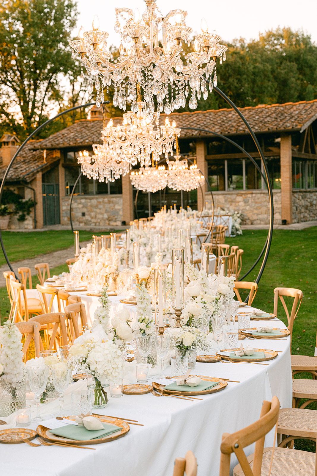 Luxury Tuscany wedding reception beneath crystal chandeliers