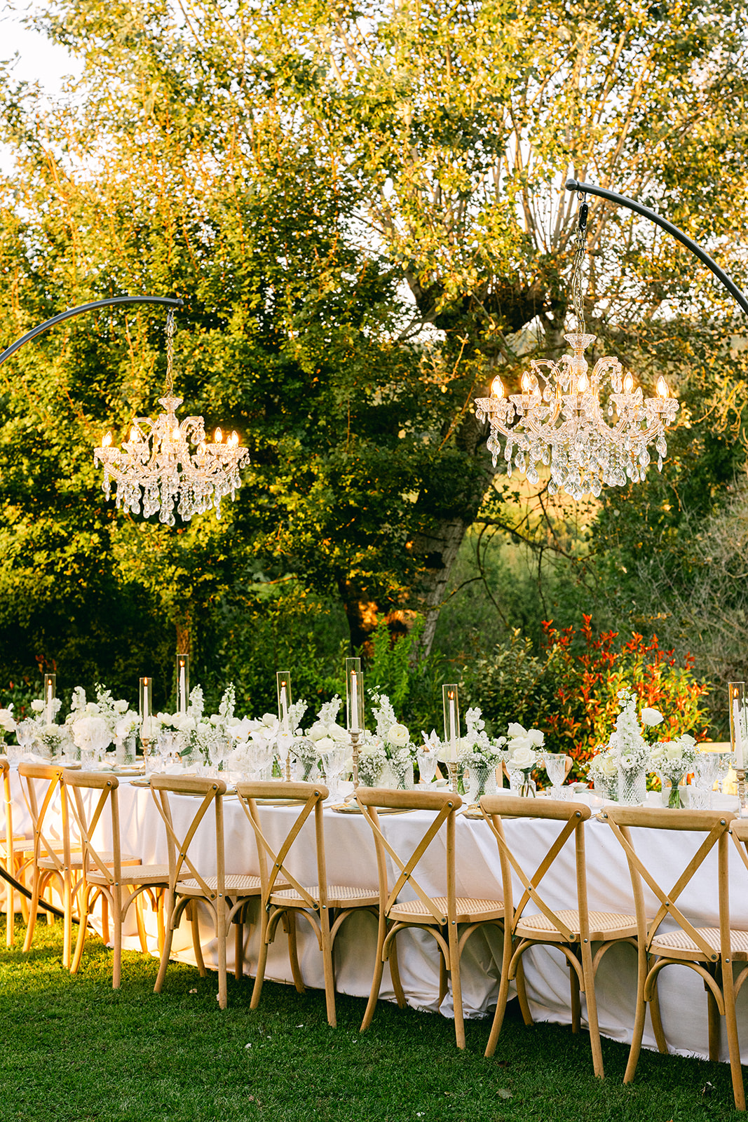 Reception tablescape at Borgo Corsignano with candlelight and floral arrangements