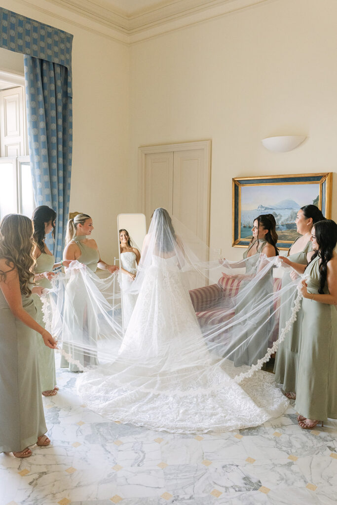 Andrea Gallucci - Destination Wedding Photographer- Amalfi Coast Positano Santorini Barcellona Rome Ravello Paris New York Bridal party gathered around the bride before walking down the aisle