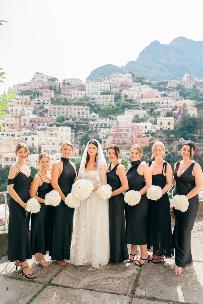 Andrea Gallucci - Destination Wedding Photographer- Amalfi Coast Positano Santorini Barcellona Rome Ravello Paris New York Bride and bridesmaids holding bouquets during wedding portraits