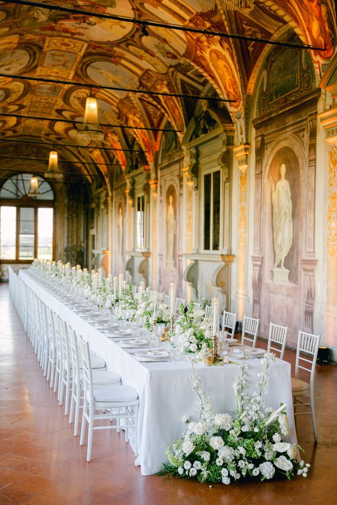 Romantic Italian destination wedding reception with candlelight and fireworks