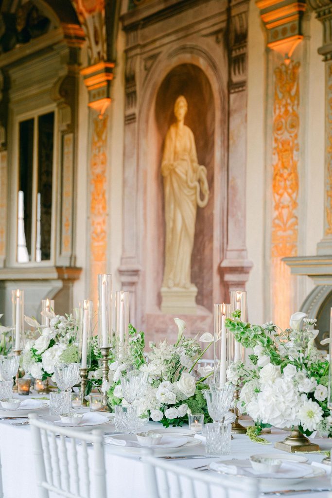 Elegant Tuscany wedding tablescape with candles and romantic Italian wedding styling