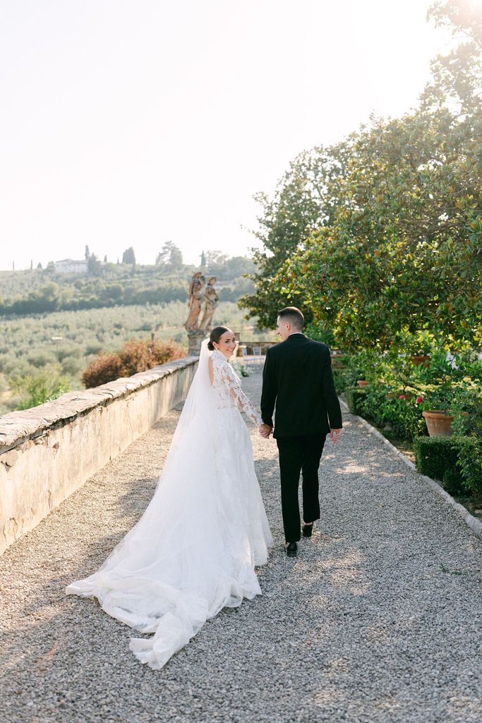 Elegant Tuscany wedding photography featuring newlyweds at a historic Italian villa
