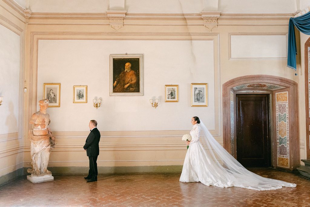 Emotional father and daughter first look before a romantic Tuscany wedding
