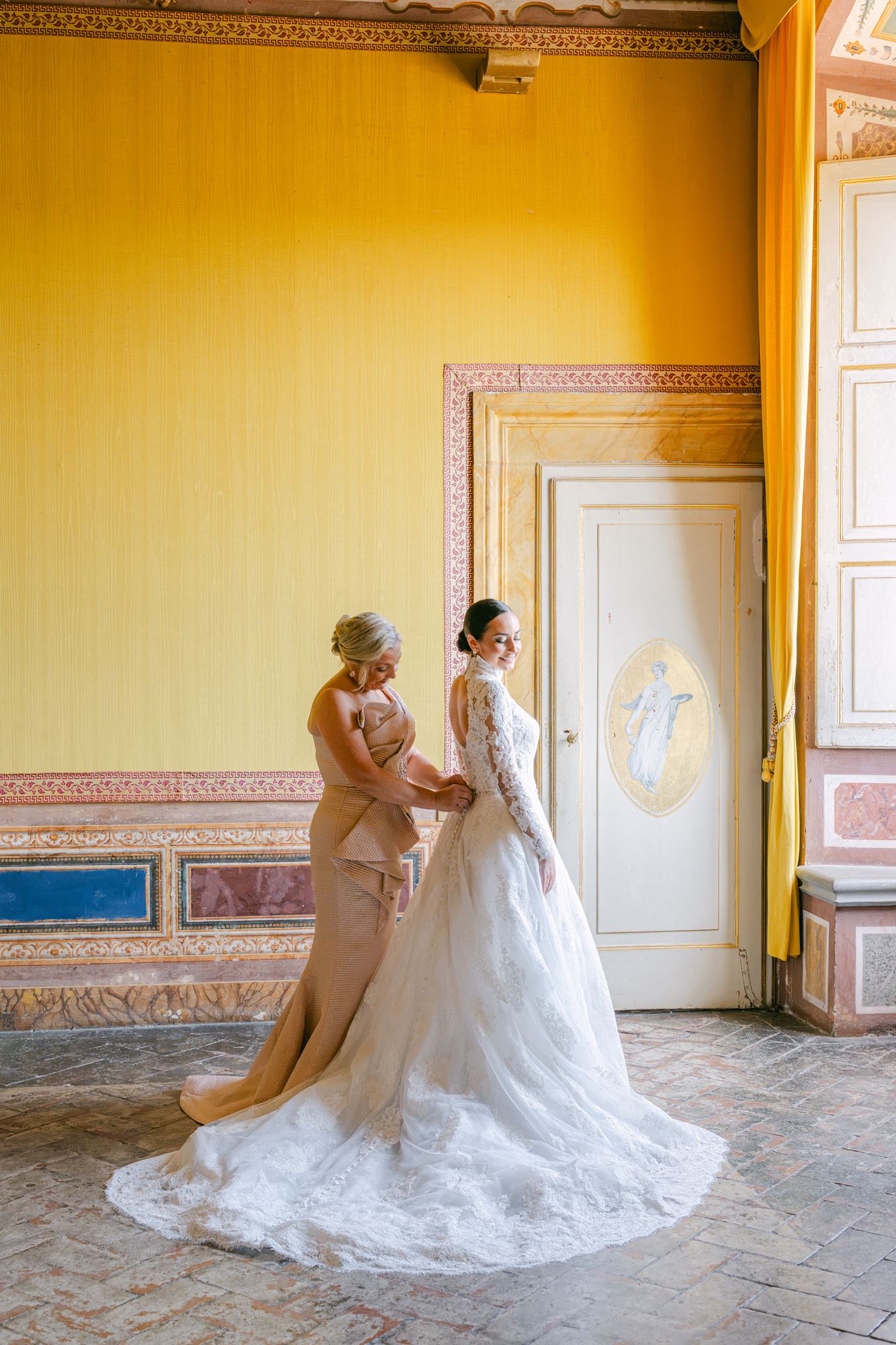 Bride getting ready with her mother before her Villa Corsini wedding in Tuscany