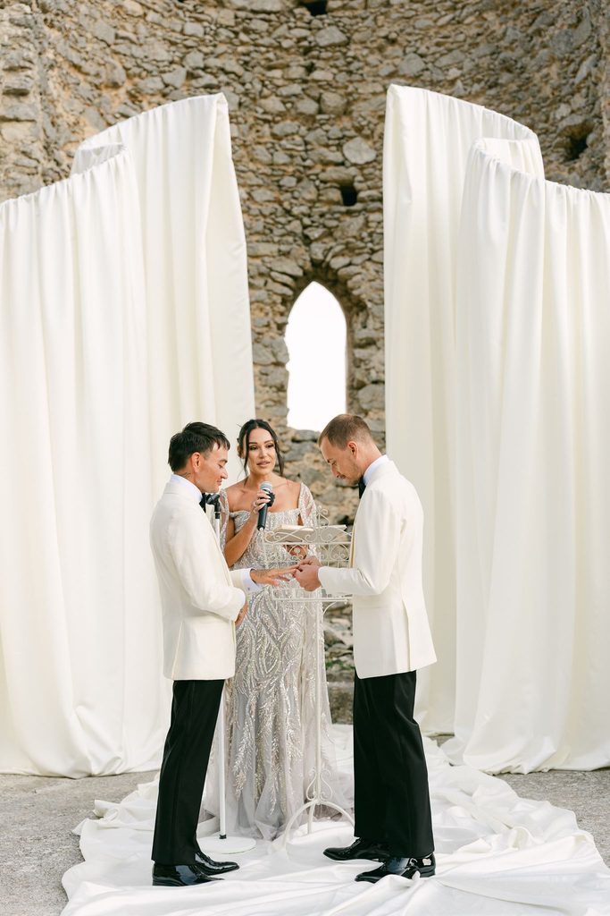 Andrea Gallucci - Destination Wedding Photographer- Amalfi Coast Positano Santorini Barcellona Rome Ravello Paris New York Two grooms exchanging wedding vows during an emotional Amalfi Coast wedding ceremony